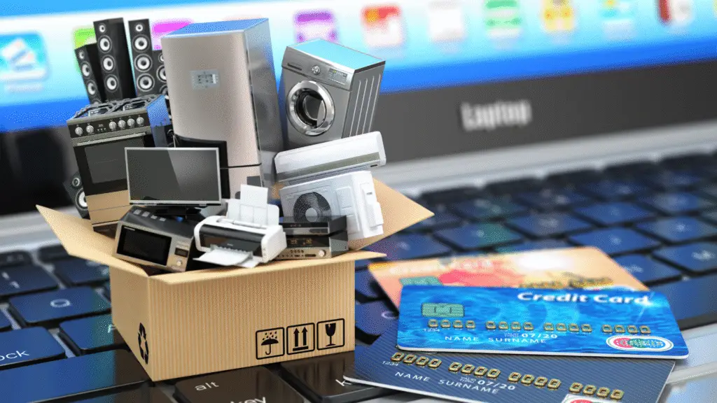 Computer With Products and credit cards on Keyboard